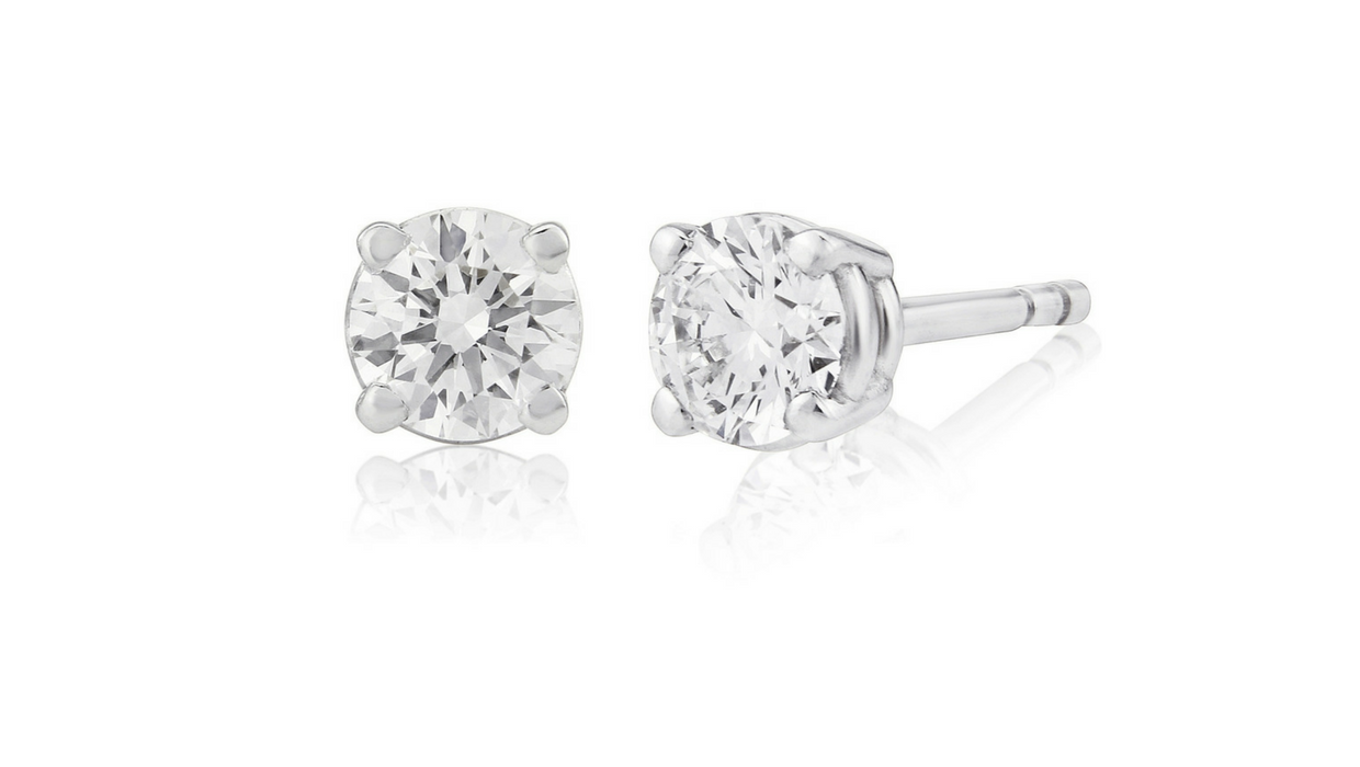 Round cut diamond studs, 0.52 carat GIA graded D, VS1 brilliant cut diamond earrings, side view